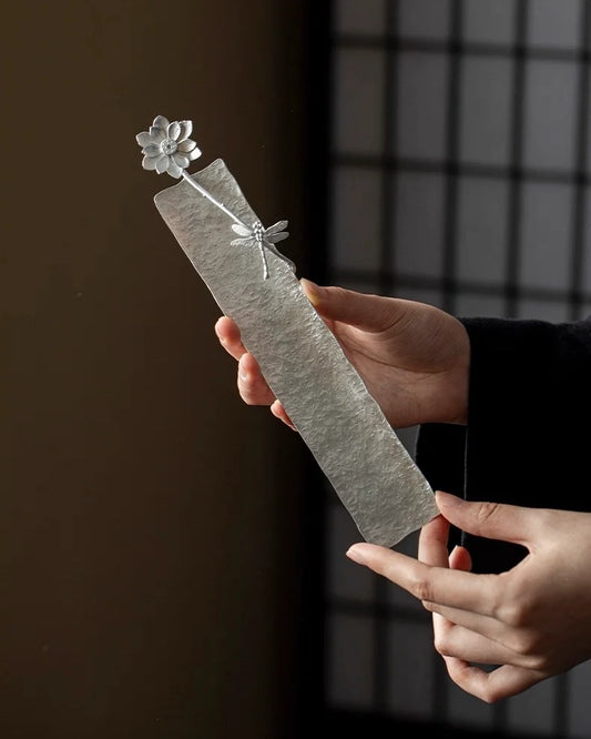 A handcrafted lotus incense holder, delicately shaped with layered petals, perfect for meditation and Feng Shui rituals.