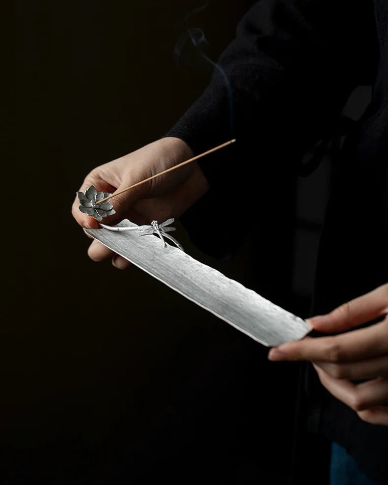 A handcrafted lotus incense holder, delicately shaped with layered petals, perfect for meditation and Feng Shui rituals.