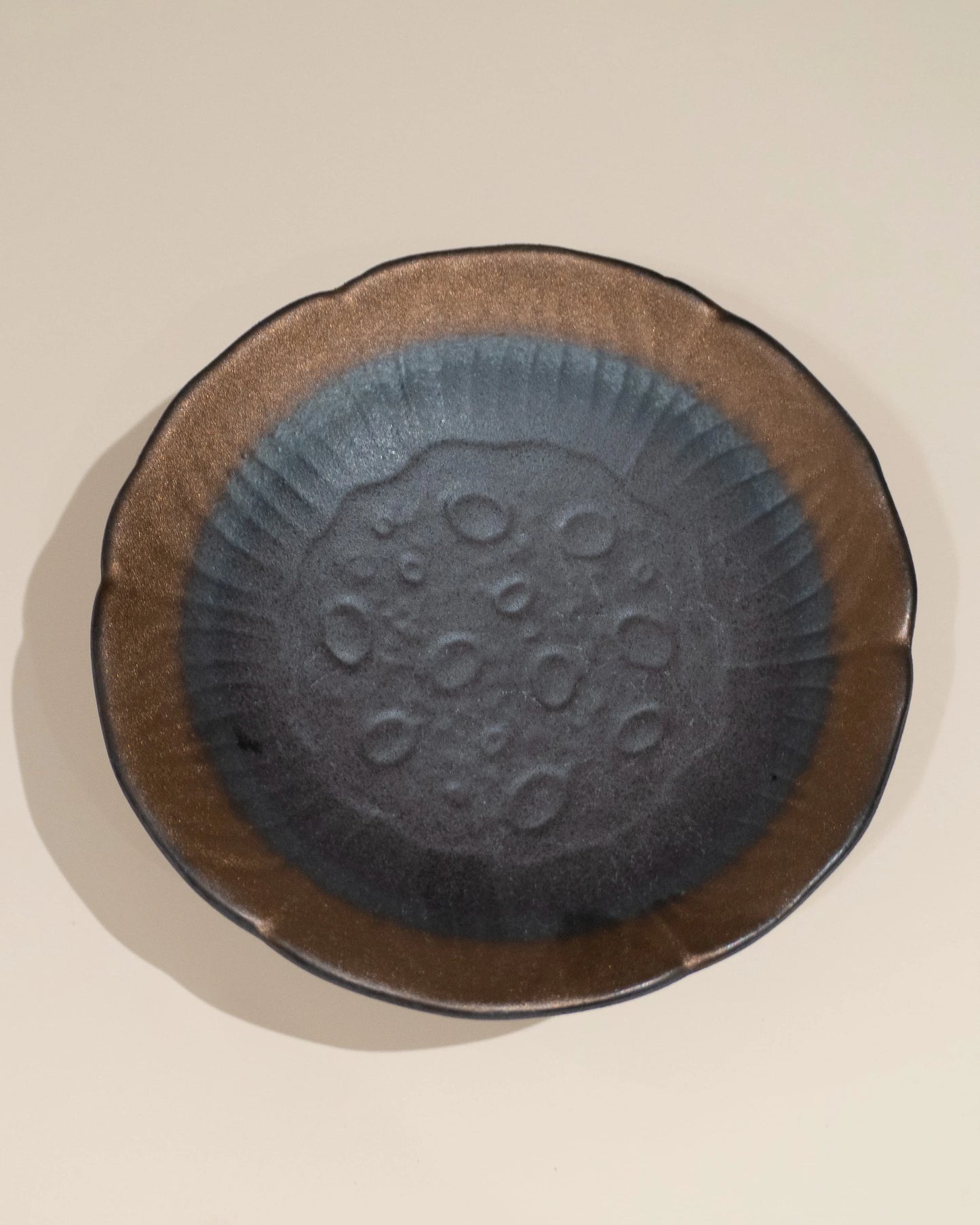 A handmade ceramic dish, creating a sense of feng shui harmony and balanced meditation energy.