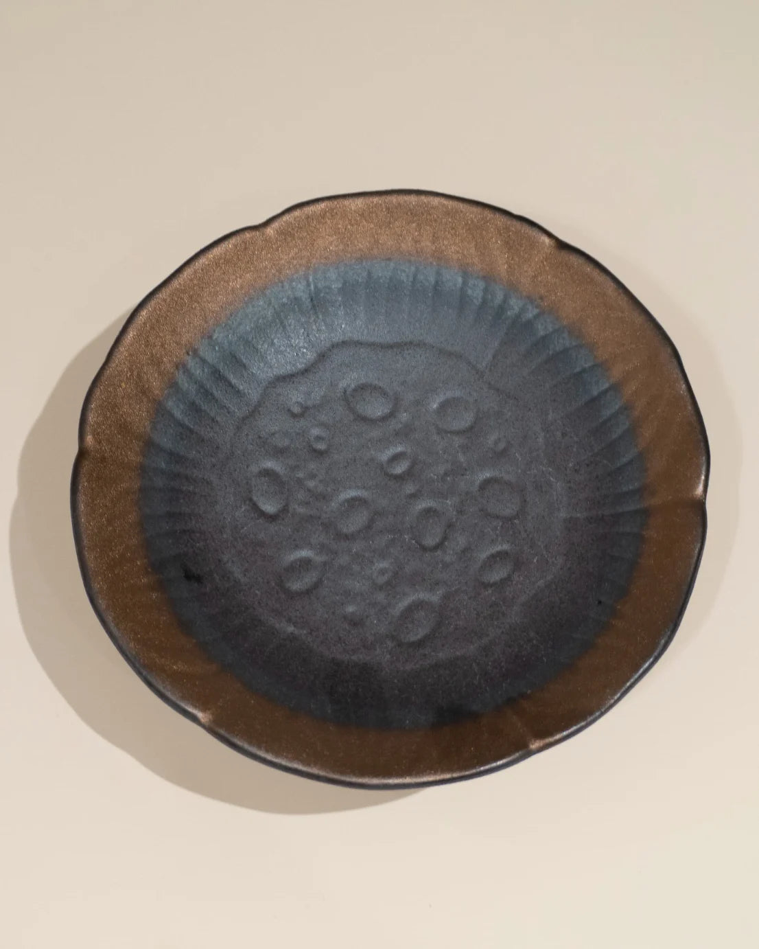 A handmade ceramic dish, creating a sense of feng shui harmony and balanced meditation energy.