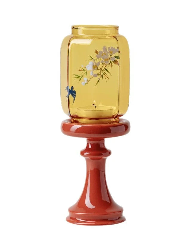 Chinese candle holders is about decorative vase shape with yellow glass top and red base