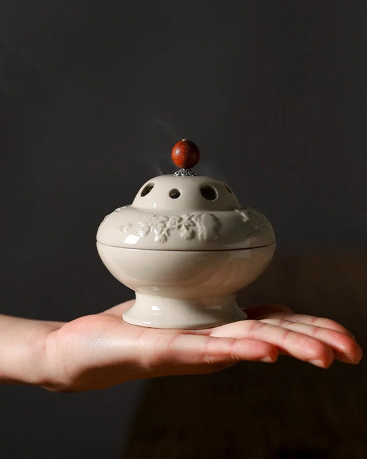 Incense bunner is crafted in wood-ash celadon glaze, the surface reveals a soft, flowing sheen, each tone born from fire and ash.