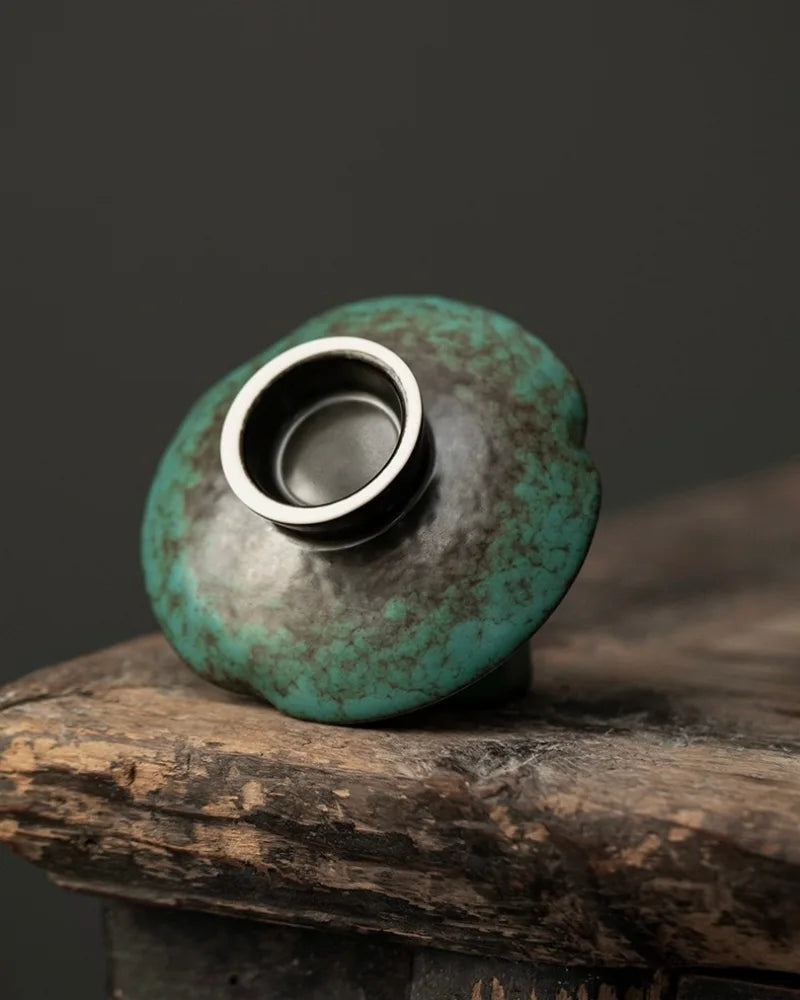 Back and pedestal detail of an Azure reactive glaze ceramic incense holder with blue-green kiln variation