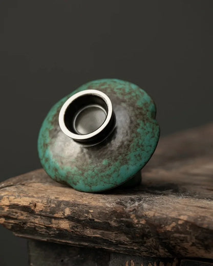 Back and pedestal detail of an Azure reactive glaze ceramic incense holder with blue-green kiln variation