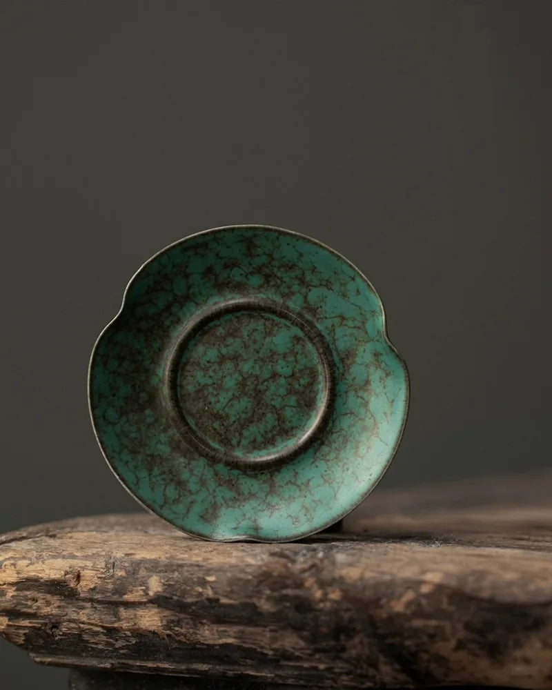 Top view of blue-green reactive glaze ceramic incense holder showing unique high-fired glaze patterns