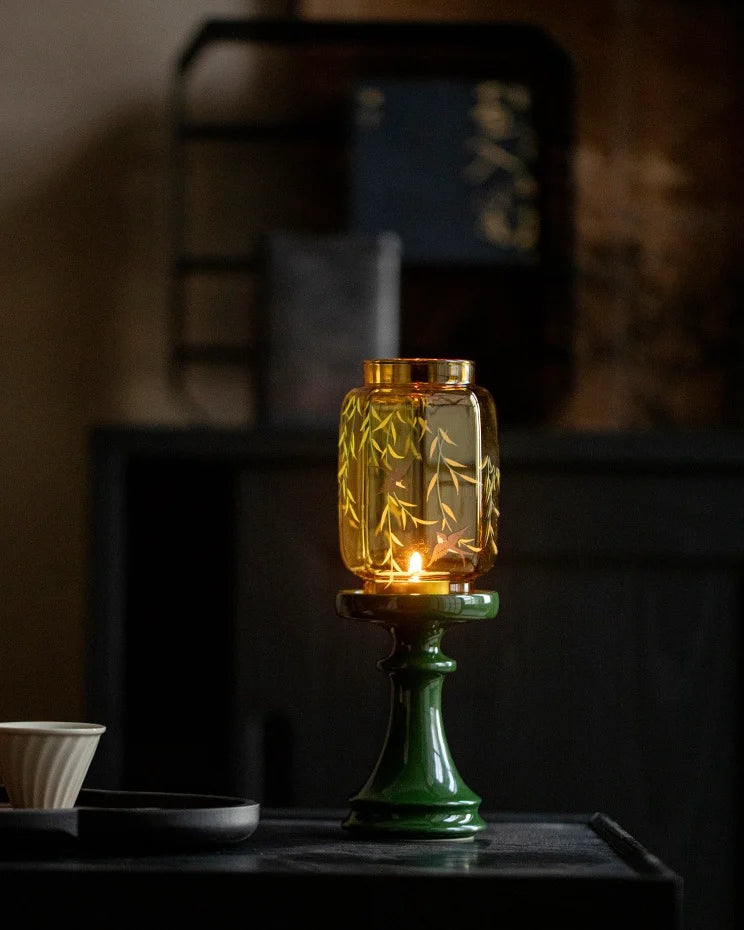 Our bifang studio's decorative candle lamp is composed of a green holder and gold top with the pattern that swallows birds by the willow